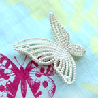 Pince à cheveux papillon perle 9.5cm