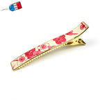 Grande pince cheveux crocodile avec décor fleurs de cerisier sur fond blanc