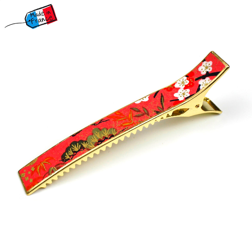 Grande pince cheveux crocodile avec décor fleurs de cerisier sur fond saumon