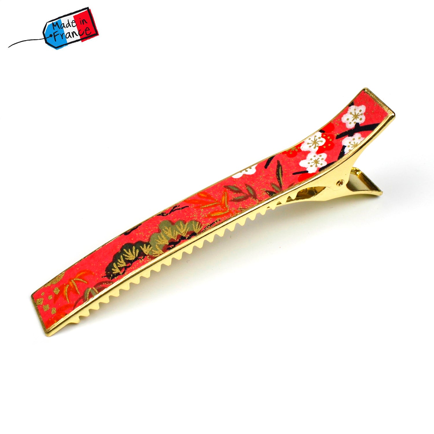 Grande pince cheveux crocodile avec décor fleurs de cerisier sur fond saumon