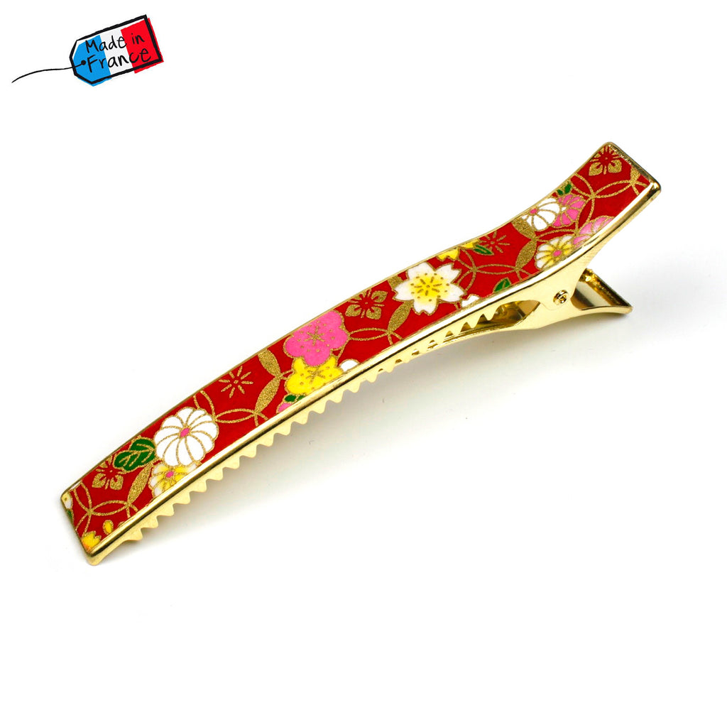 Grande pince cheveux crocodile avec décor fleurs de cerisier sur fond rouge