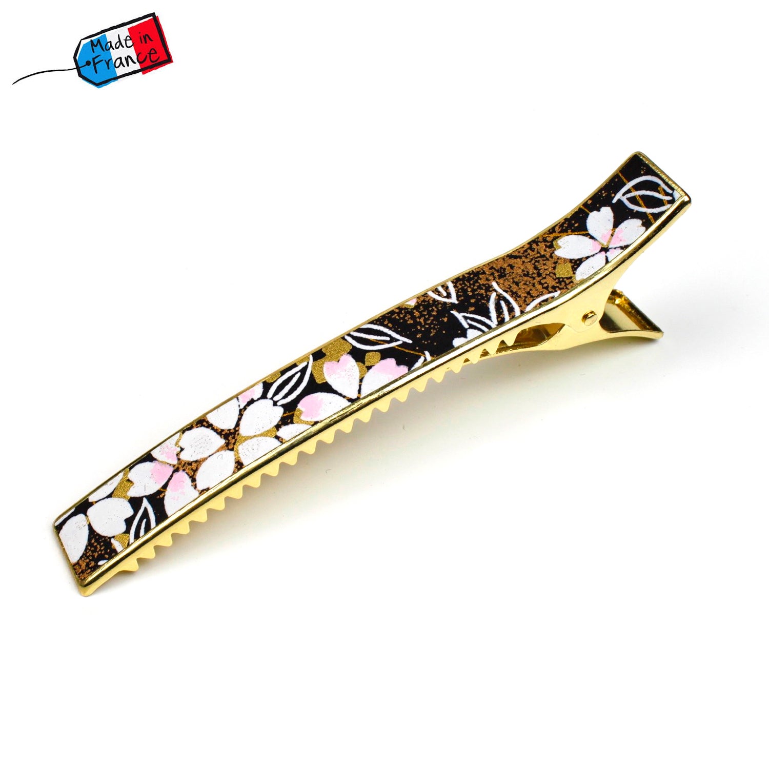 Grande pince cheveux crocodile avec décor fleurs de cerisier blanches sur fond doré noir