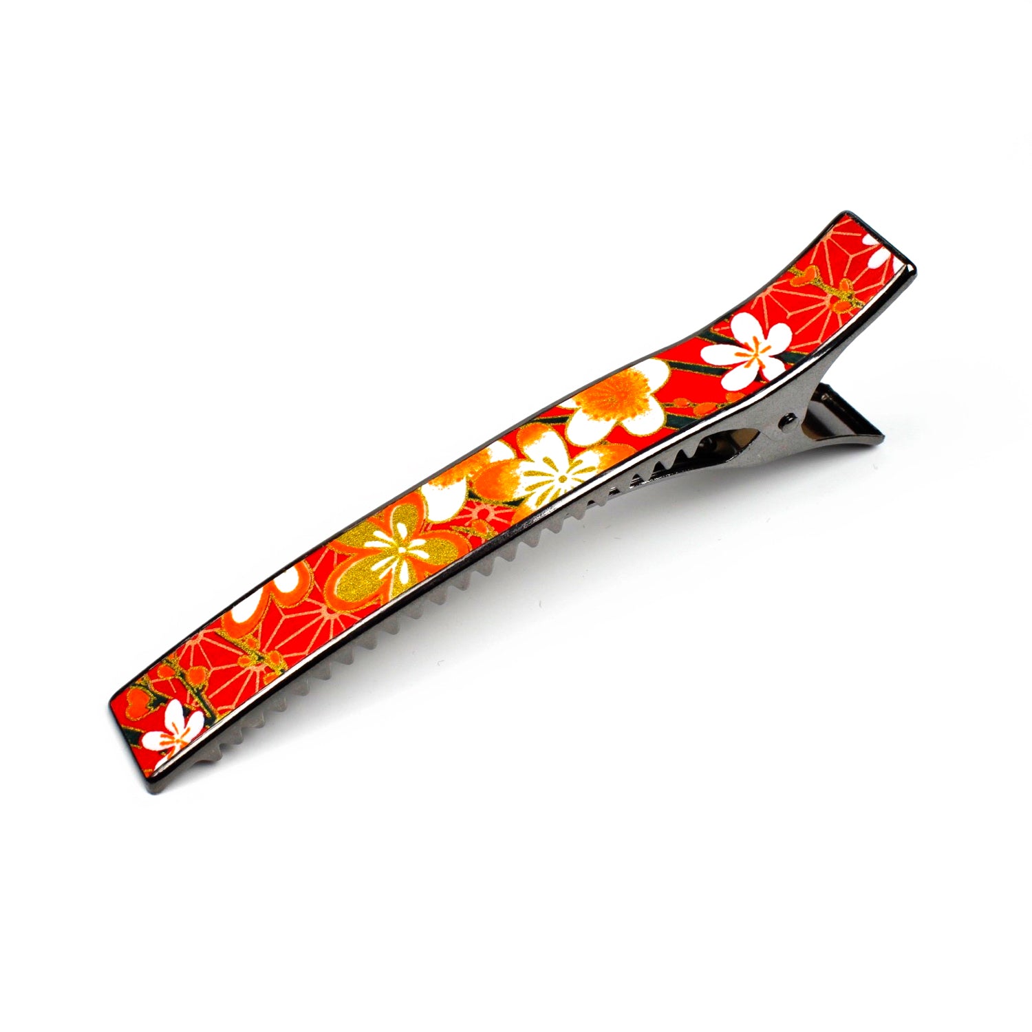 Grande pince cheveux crocodile avec décor fleurs de cerisier sur fond orangé